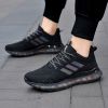 Popular men's breathable flying woven sneakers casual mesh shoes Popcorn sole running shoes 39-44